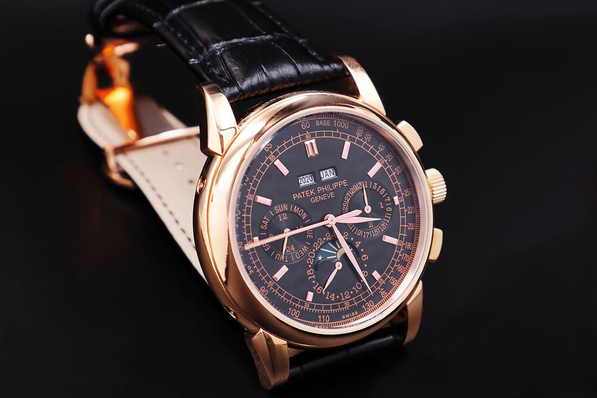 Classic Patek Phillipe 5204 watch - Rose gold with black dial and leather strap.