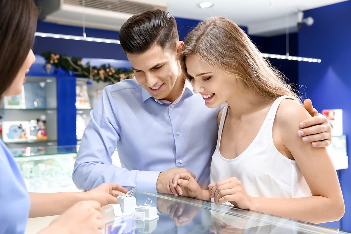 Couple buying engagement ring
