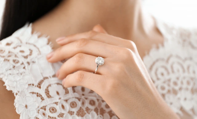 young bride wearing a beautiful engagement ring, closeup