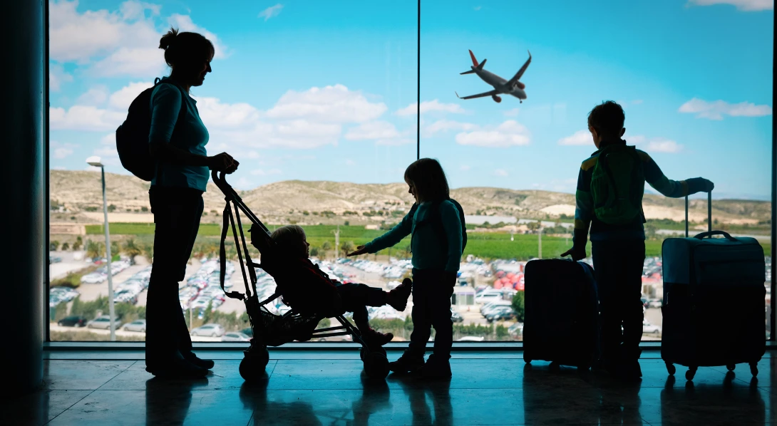Woman at airport with family