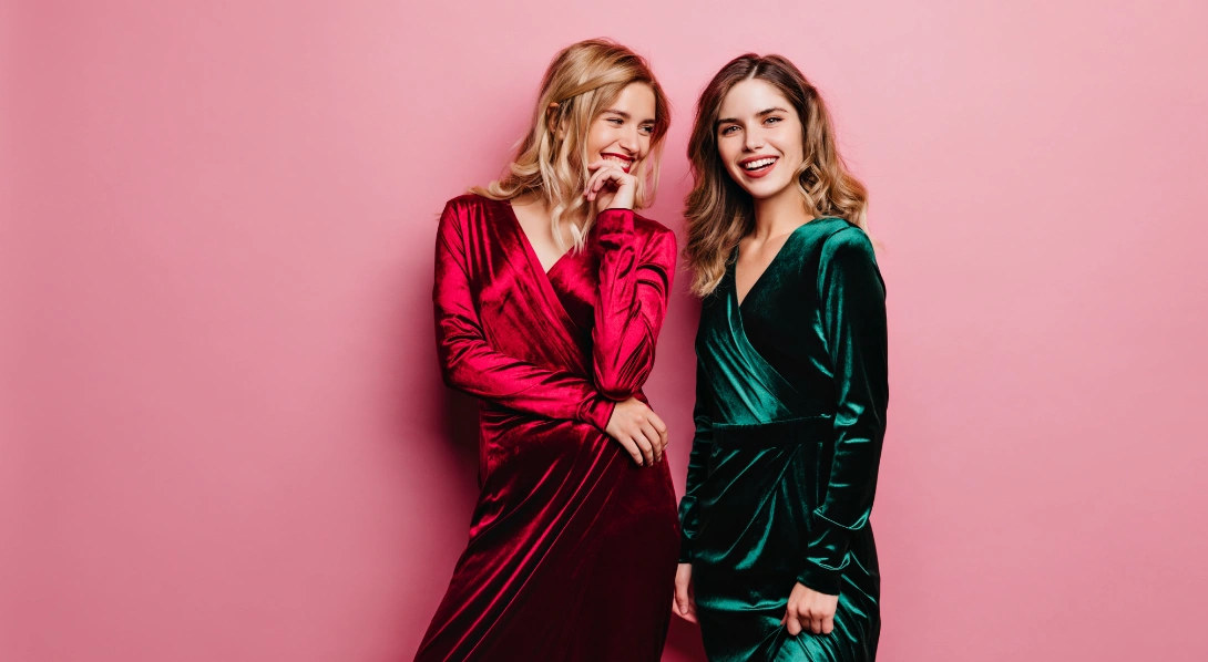 Women wearing red and green dresse