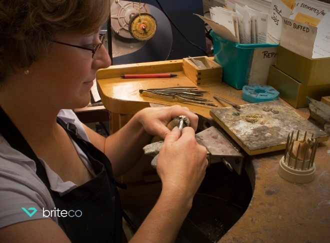 Bench jeweler working in studio