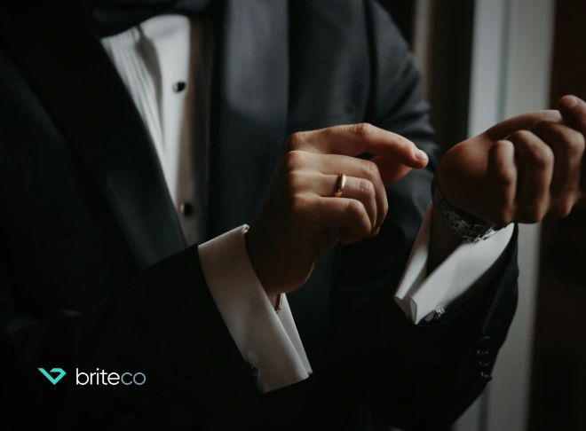 Man adjusting traditional cufflinks