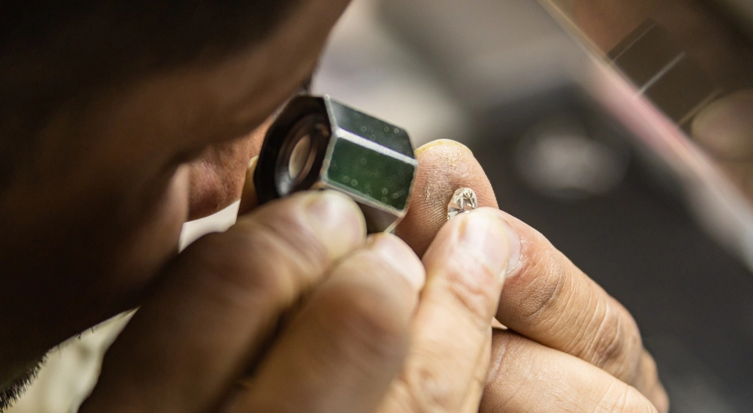 Jeweler analyzing diamond