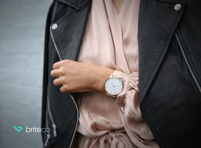 Woman wearing a watch that matches her outfit